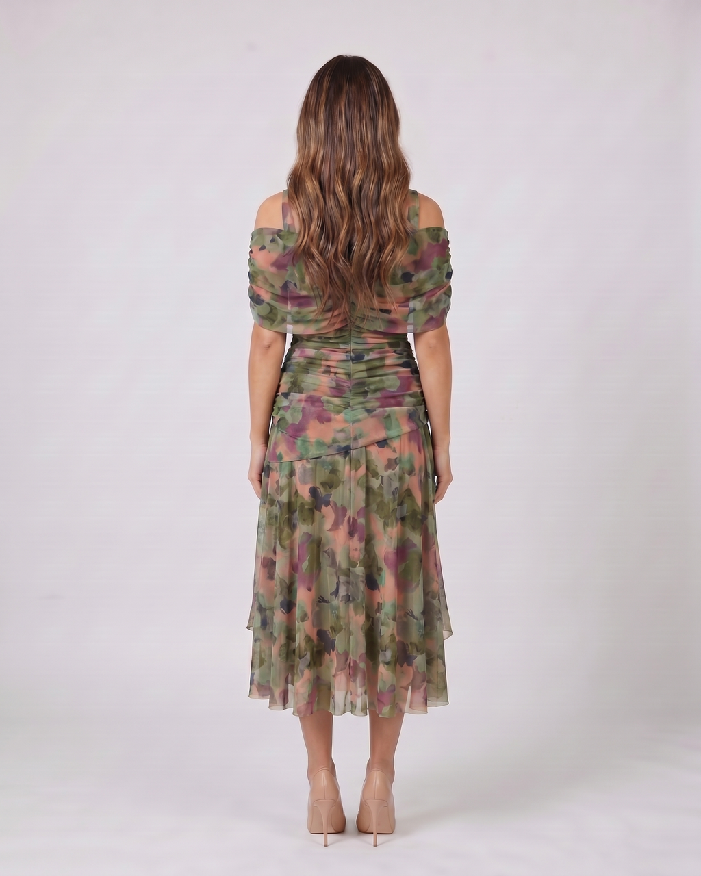 Back view of multicolor off shoulder draped midi dress showing solid back with ruched waist detail
