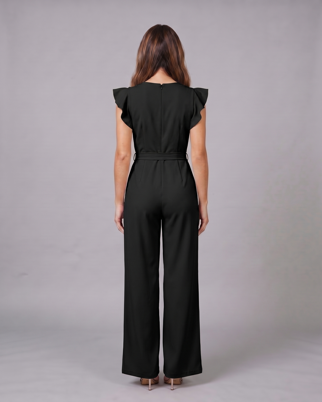 Back view of black wedding guest ruffle sleeve wide leg jumpsuit showing solid back with invisible zipper closure