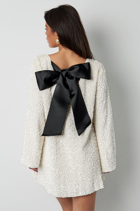 Women cream bateau neck mini dress with long sleeves and black back bow detail
