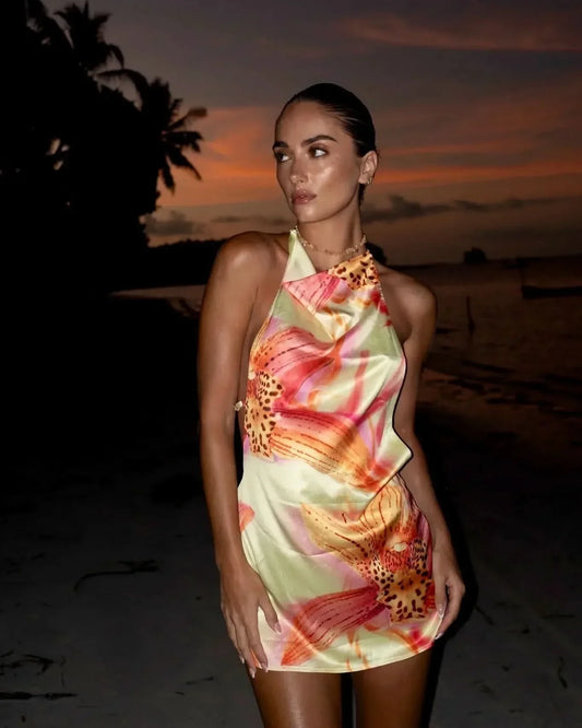 Women halter mini dress with floral print front-facing view showing draped neckline and tropical flower motif
