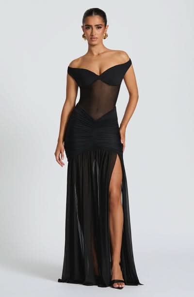 Black off-shoulder formal maxi dress with ruched hips and sheer mesh bodice detail