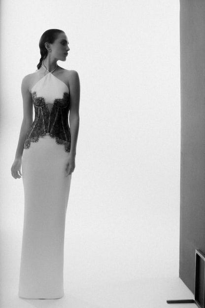 Side profile of women cream maxi dress with lace corset and full-length silhouette