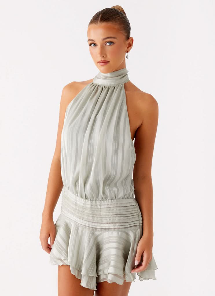 Women sage green pleated halter mini dress with drop waist and ruffle hem