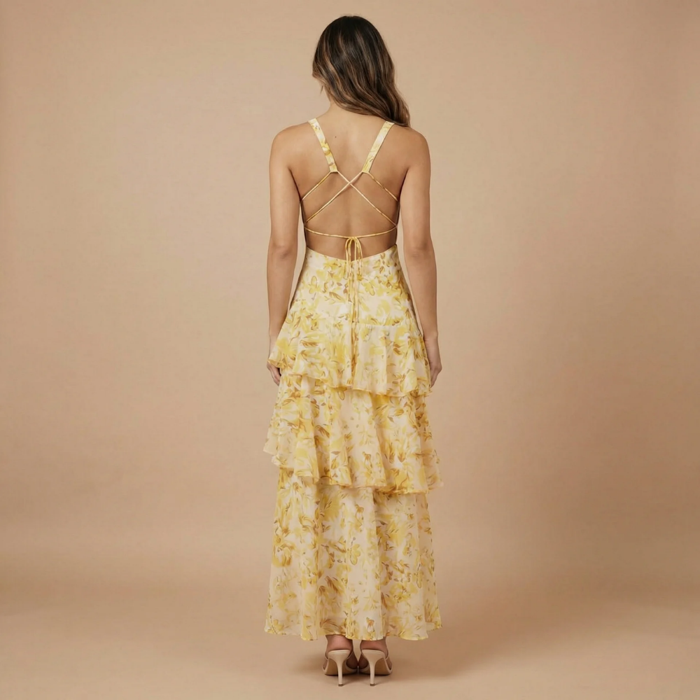 Back view of yellow floral midi dress with crossback straps