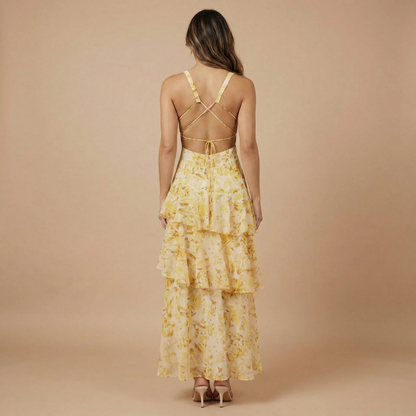 Back view of yellow floral midi dress with crossback straps