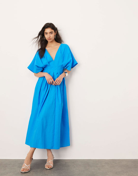Women's blue midi dress with V-neckline, short flutter sleeves, and pleated waist detail