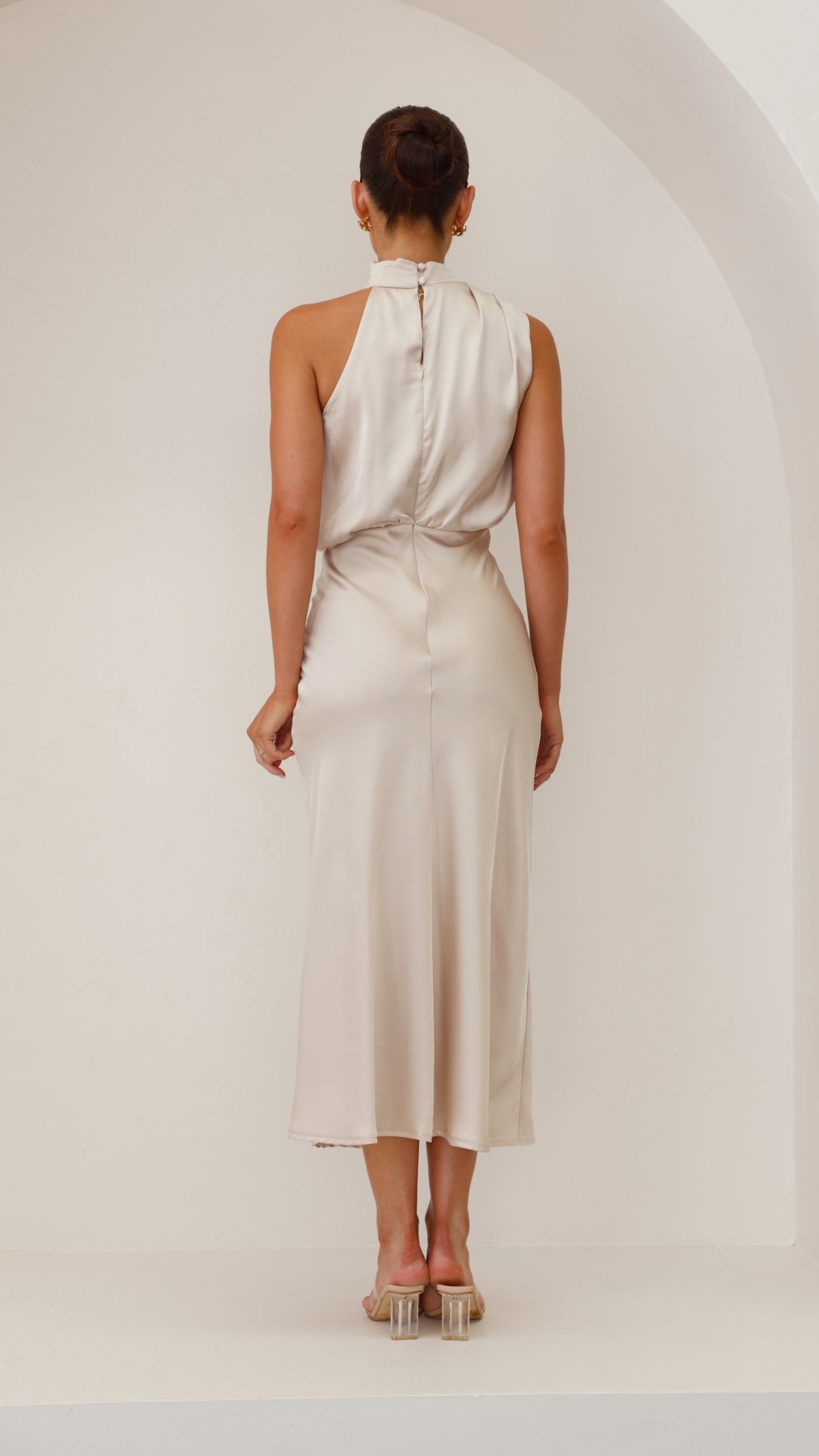 Women cream midi dress back view showing full-length back zip closure and button detail