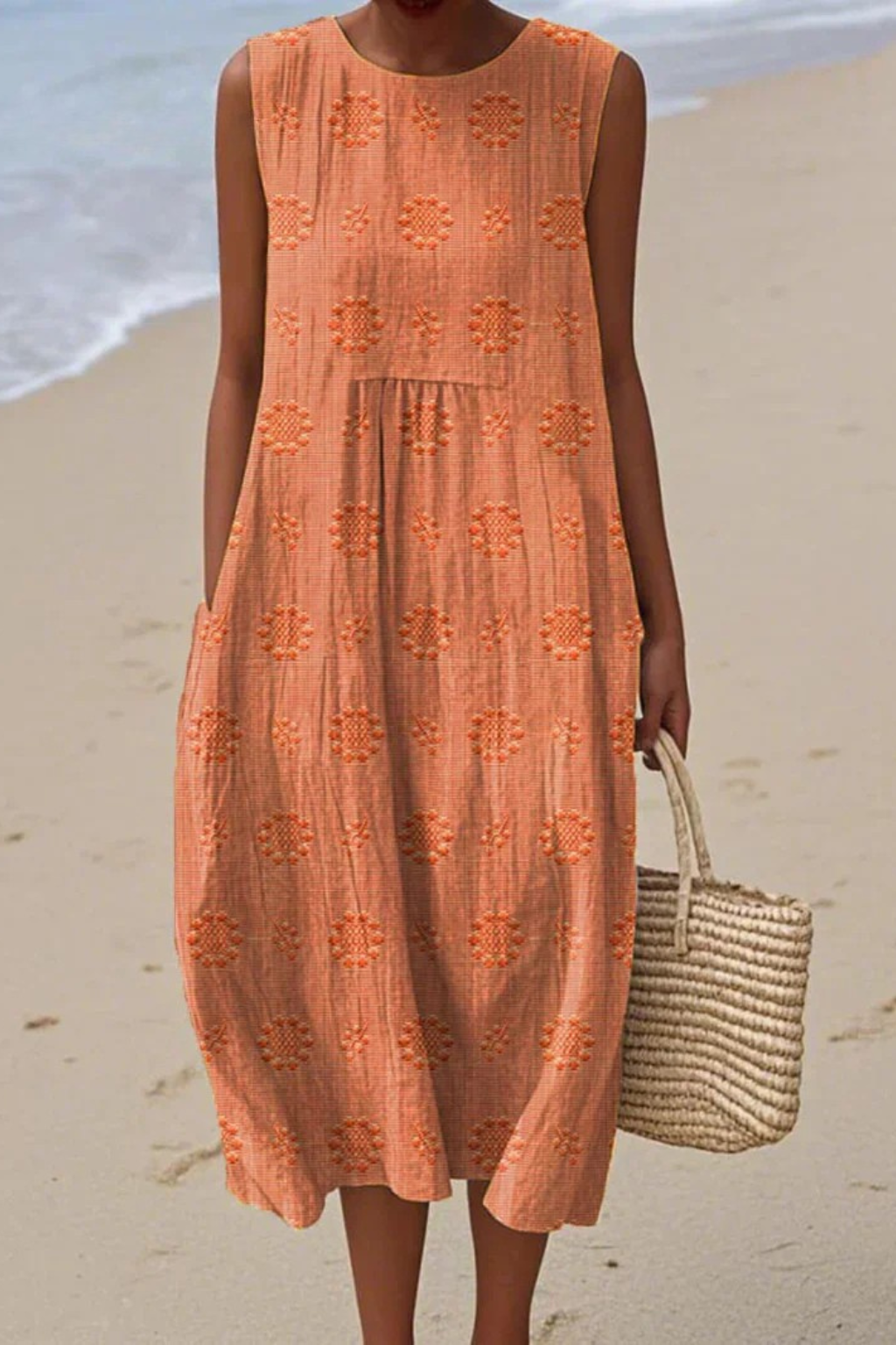 Women coral sleeveless round neck embroidered midi dress with flowing skirt