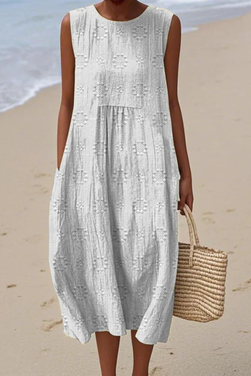 Women white sleeveless round neck midi dress with allover embroidery pattern