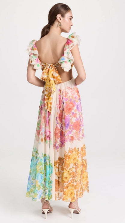 Women cream floral maxi dress with ruffled sleeves and open back tie detail rear view