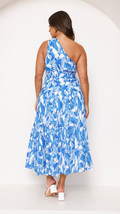 Women blue and white floral tiered midi dress back profile with knotted shoulder strap