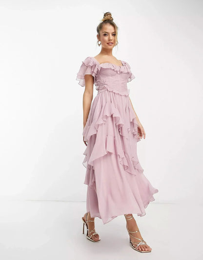 Pink midi dress with off-shoulder ruffles and flowing tiered skirt detail