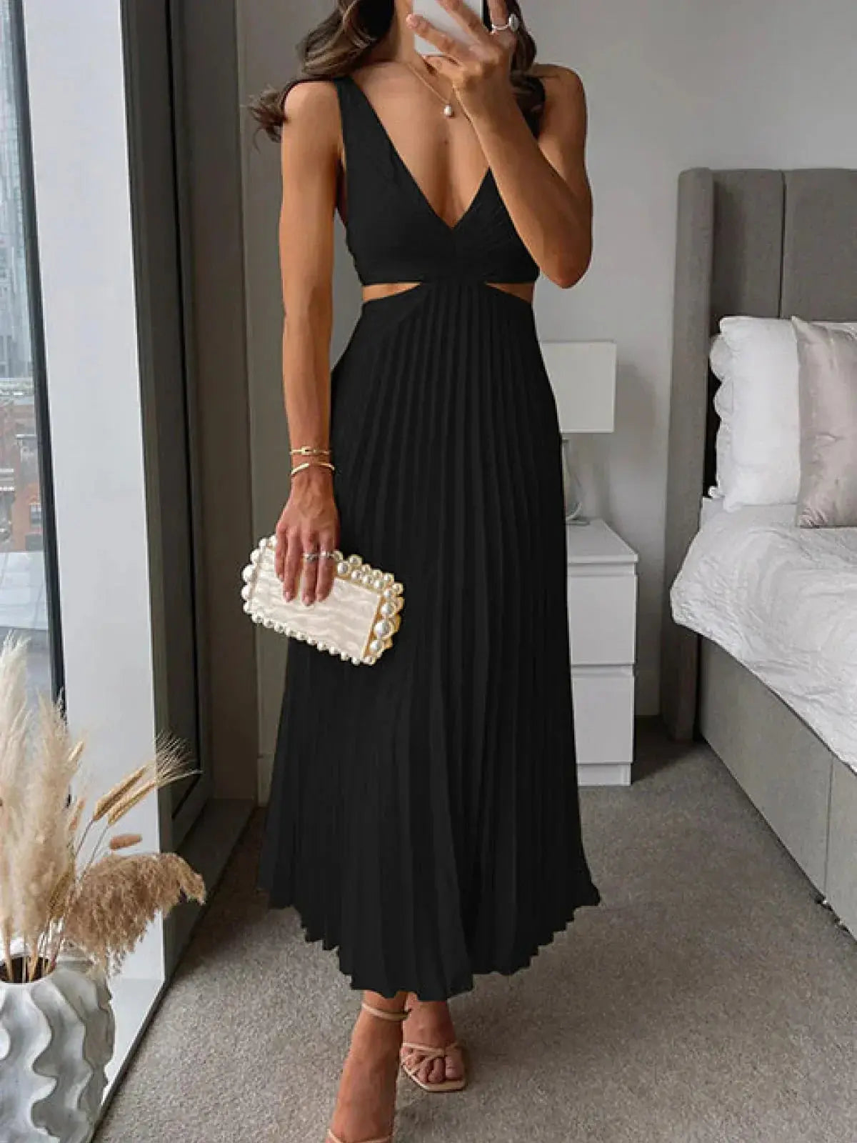 Women black pleated midi dress with V-neckline and side waist cutouts