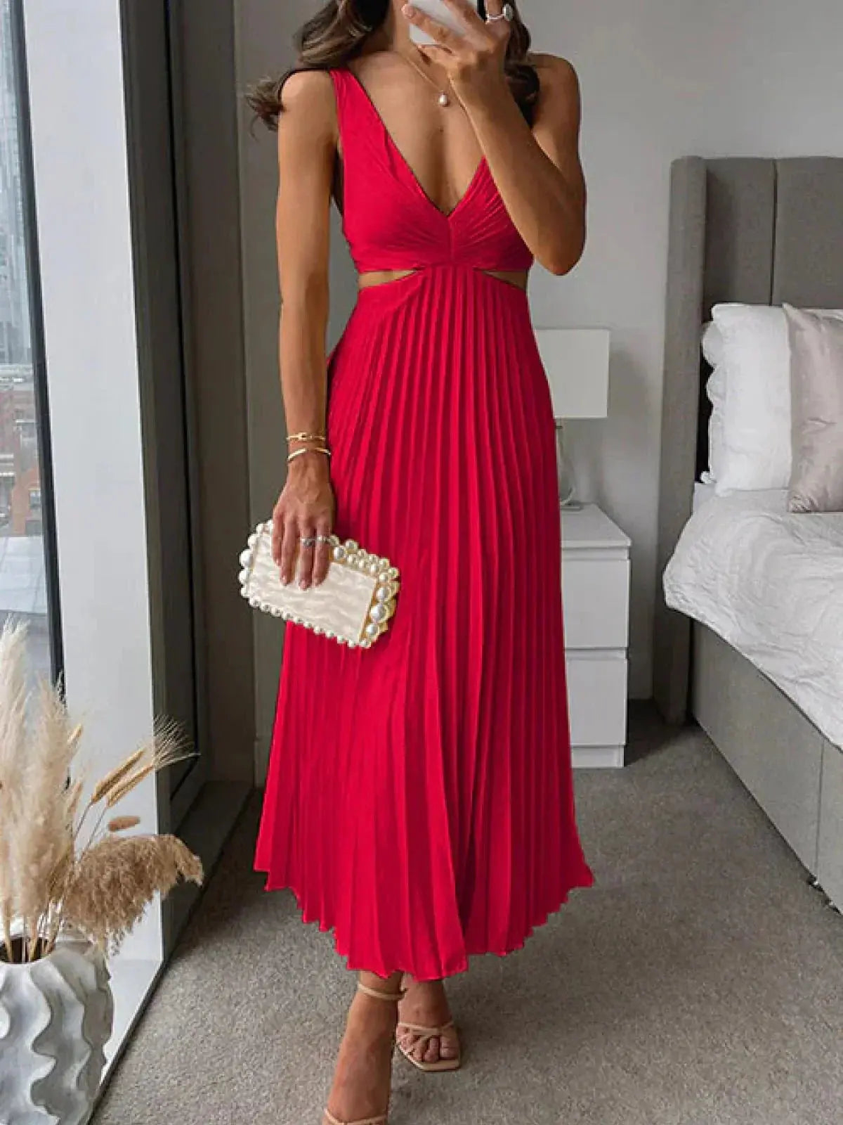 Women red pleated midi dress with deep V-neck and waist cutout details