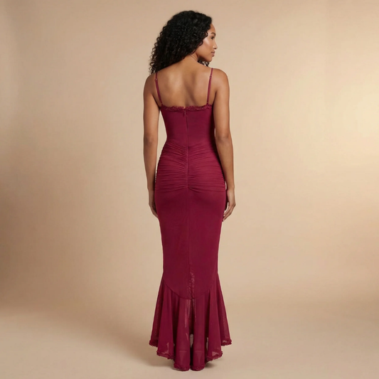 Back view of women's burgundy maxi dress showing center zipper closure and flowing hem
