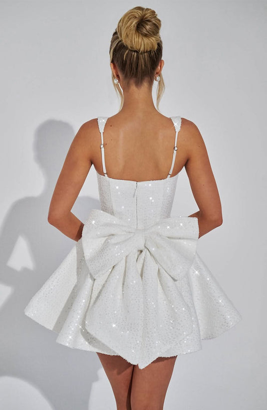 Women white sequin mini dress back view showing centered bow detail
