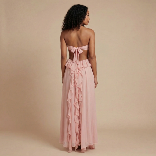Women blush pink sweetheart maxi dress with tie-back bow closure and ruffled hem detail, back view