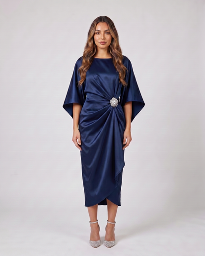 navy blue bateau neck gathered waist midi dress front view with crystal brooch