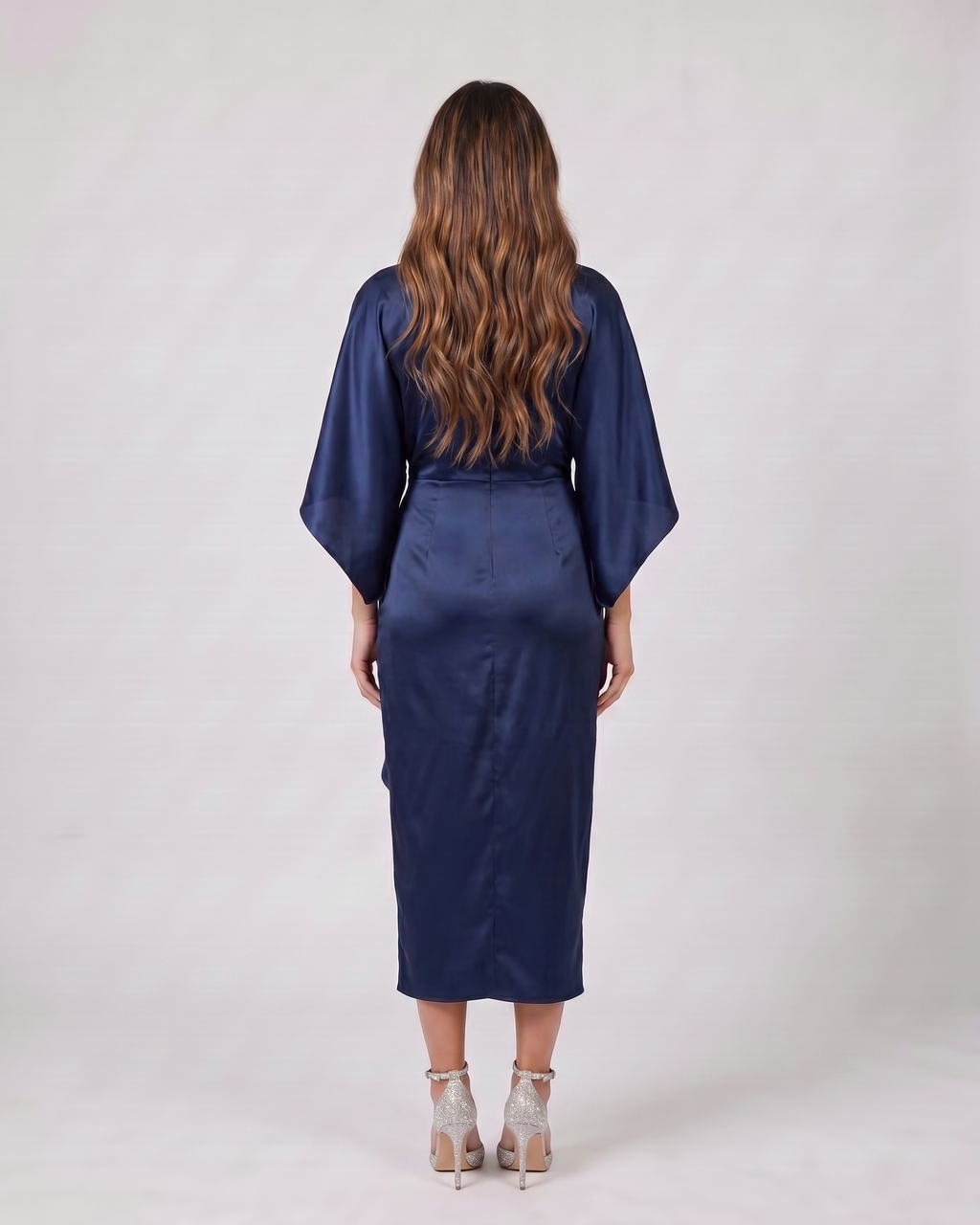Back view of navy blue bateau neck gathered waist midi dress showing solid back