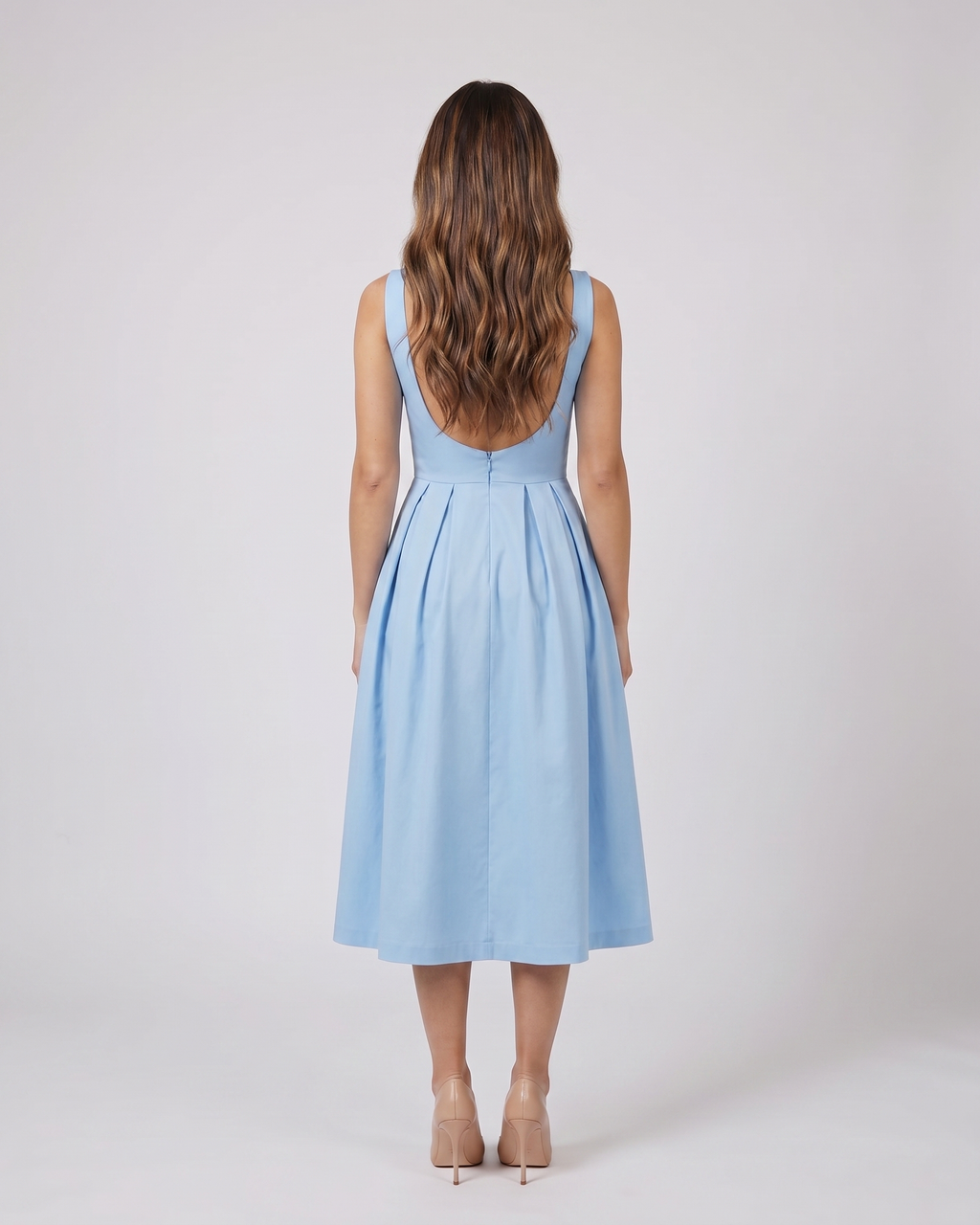Back view of blue boat neck a-line midi dress showing Open back