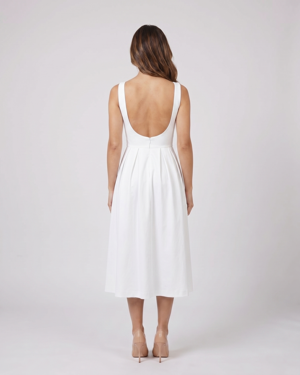Back view of white boat neck a-line midi dress showing Open back