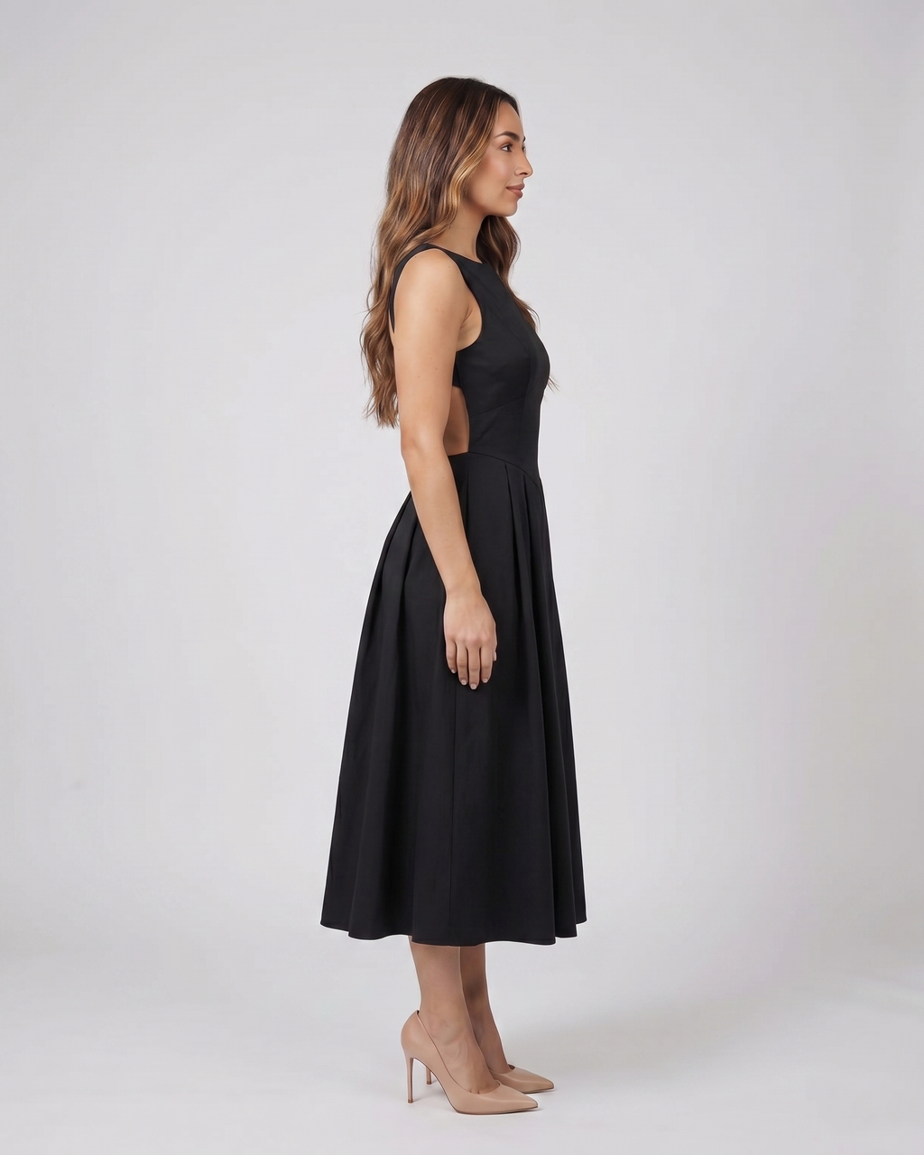 Side view of black boat neck a-line midi dress