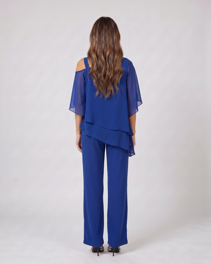 Back view of blue cold shoulder layered straight leg pant set showing solid back