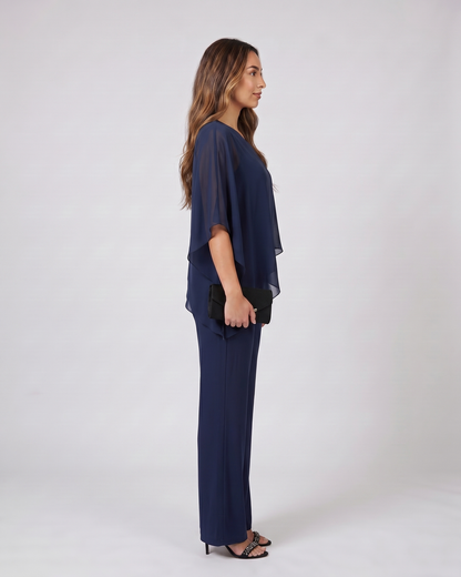 Side view of navy cold shoulder layered straight leg pant set