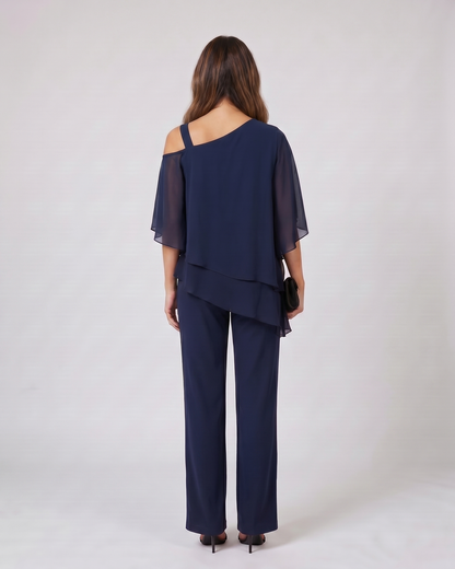 Back view of navy cold shoulder layered straight leg pant set showing solid back