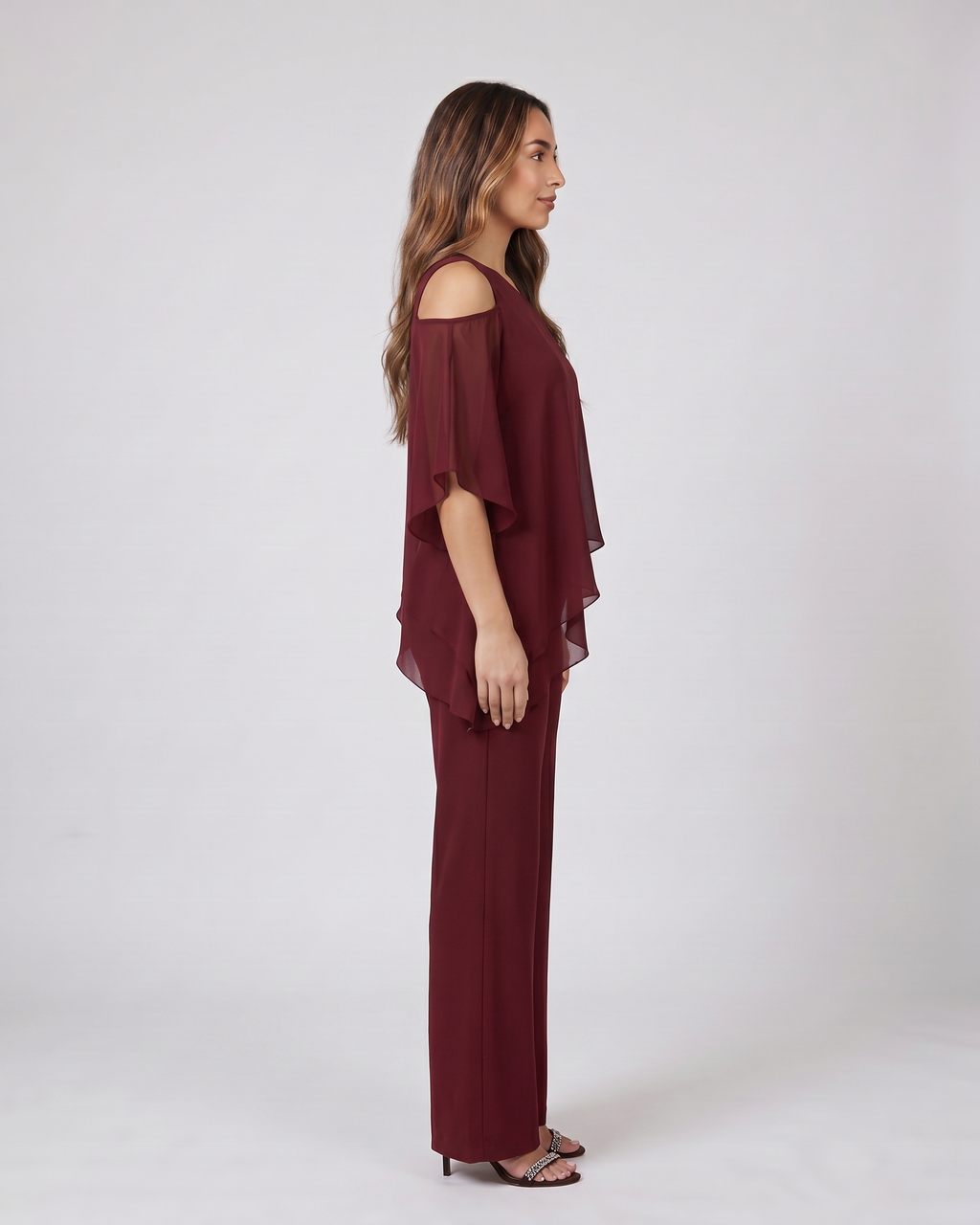 Side view of burgundy cold shoulder layered straight leg pant set