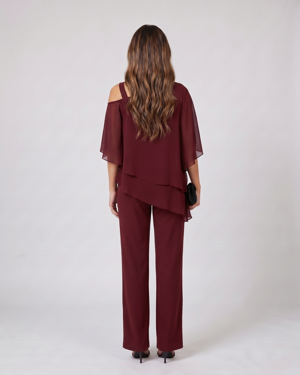 Back view of burgundy cold shoulder layered straight leg pant set showing solid back