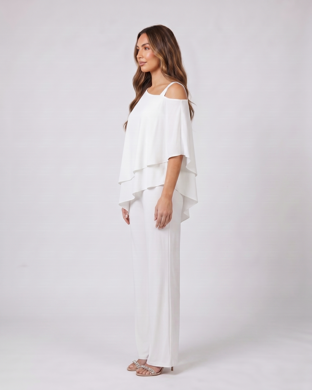 Side view of white cold shoulder layered straight leg pant set