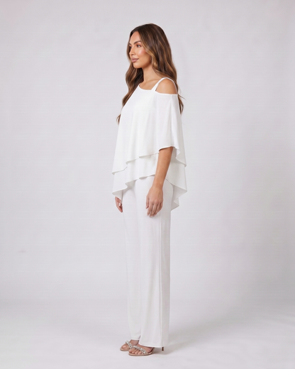 Side view of white cold shoulder layered straight leg pant set