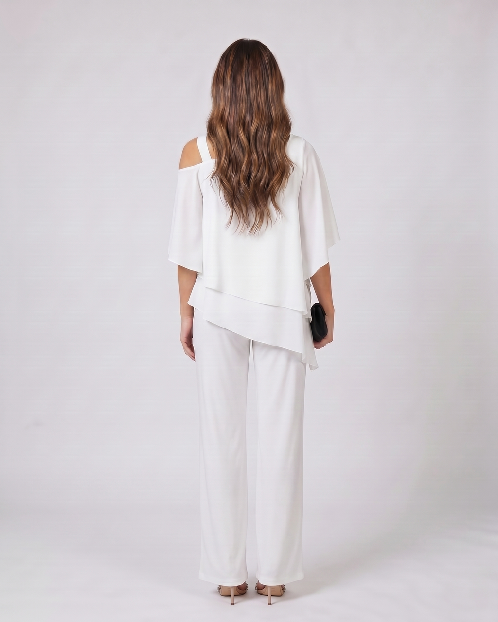Back view of white cold shoulder layered straight leg pant set showing solid back
