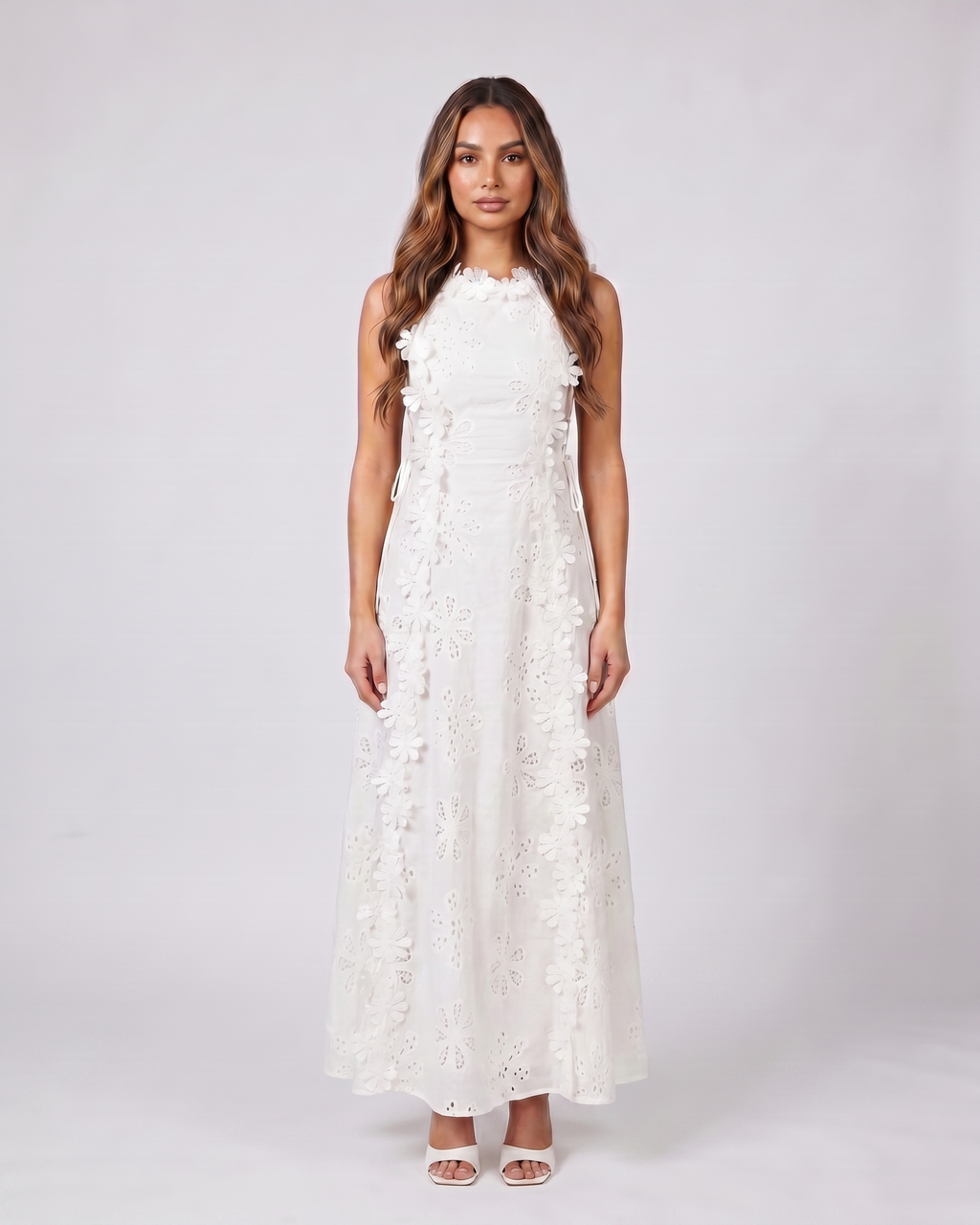 white eyelet lace high neck side tie maxi dress front view with floral eyelet open-panel detail and 3D floral appliques