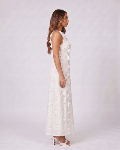 Side view of white eyelet lace high neck side tie maxi dress
