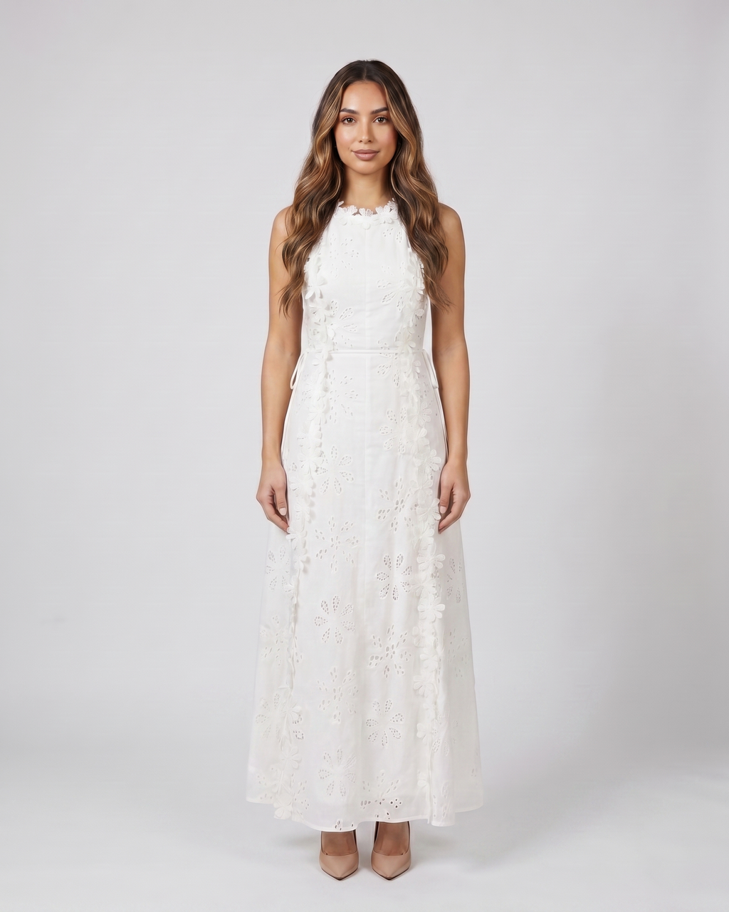 Back view of white eyelet lace high neck side tie maxi dress showing open back with vertical lace-up closure