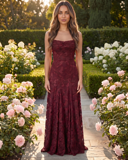 Model in burgundy floral lace square neck maxi dress in tuscan setting