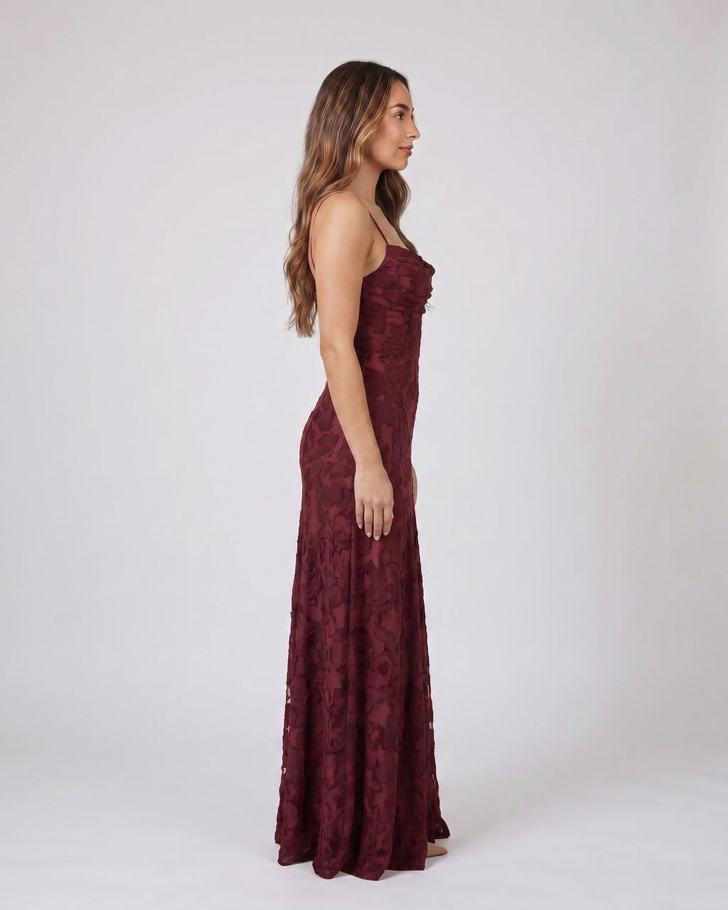 Side view of burgundy floral lace square neck maxi dress