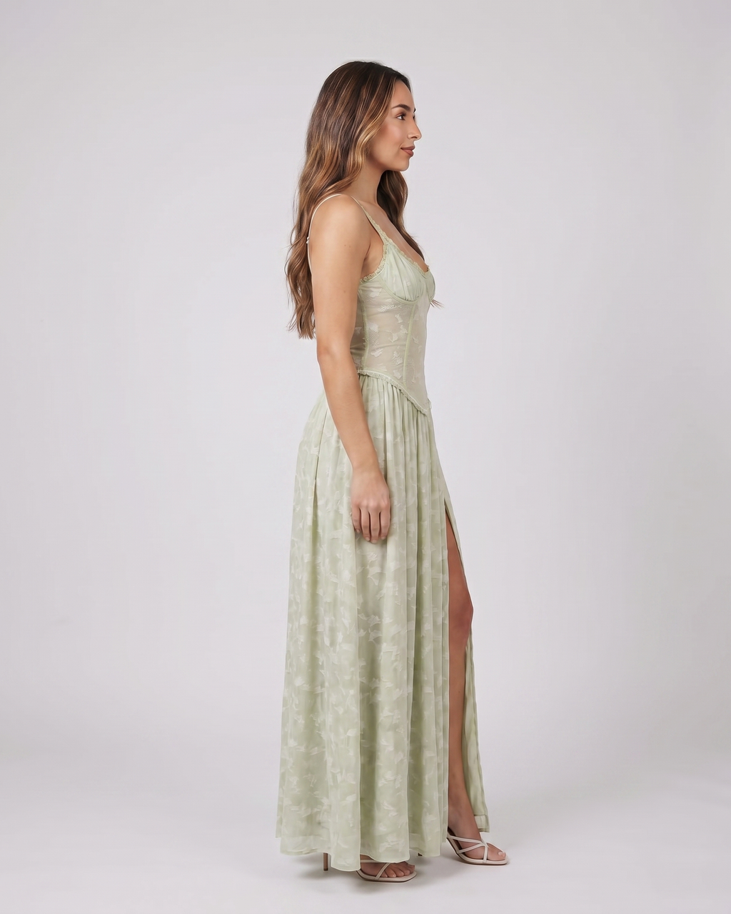 Side view of green floral scoop neck with slit maxi dress