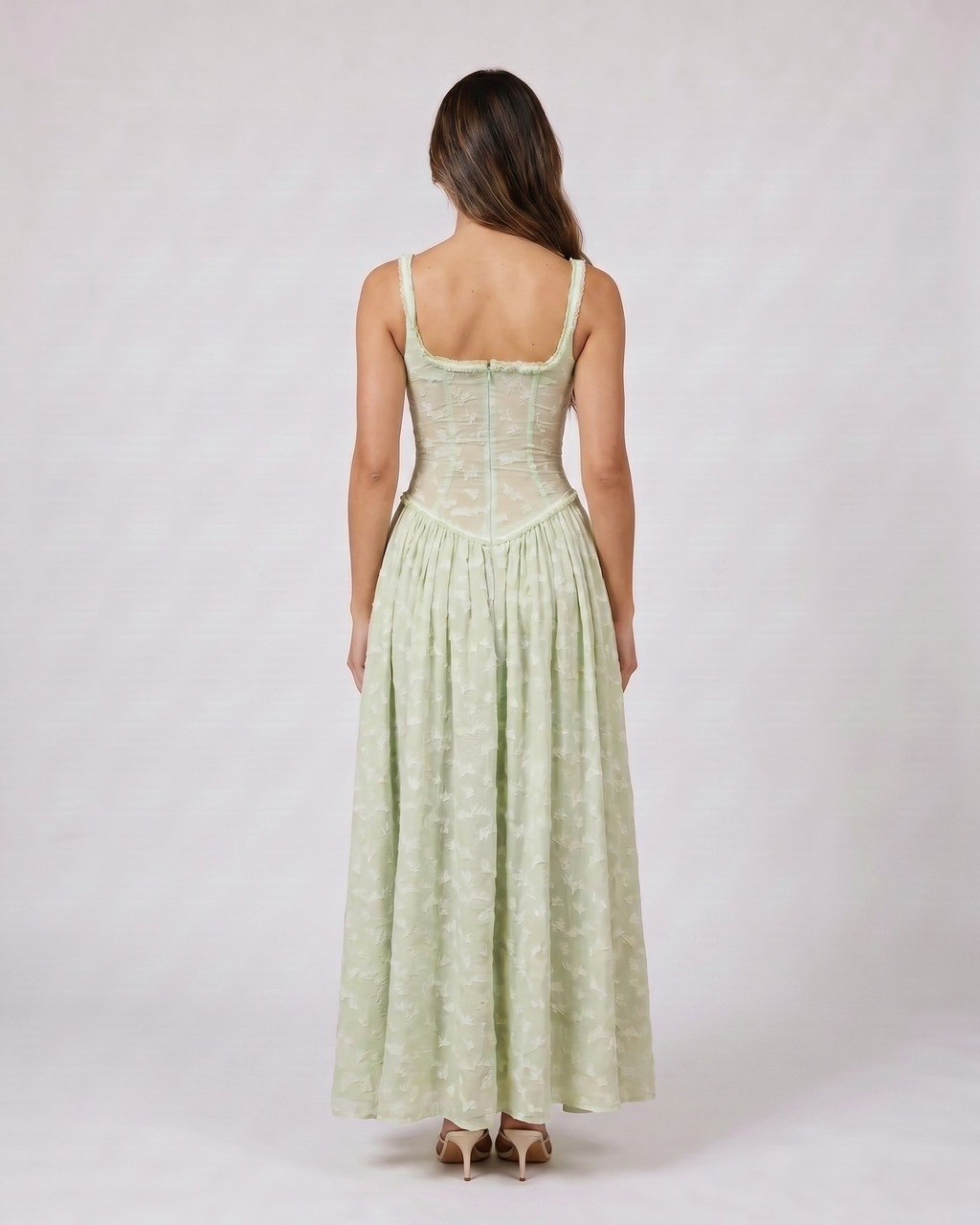 Back view of green floral scoop neck with slit maxi dress showing solid back with scoop neckline