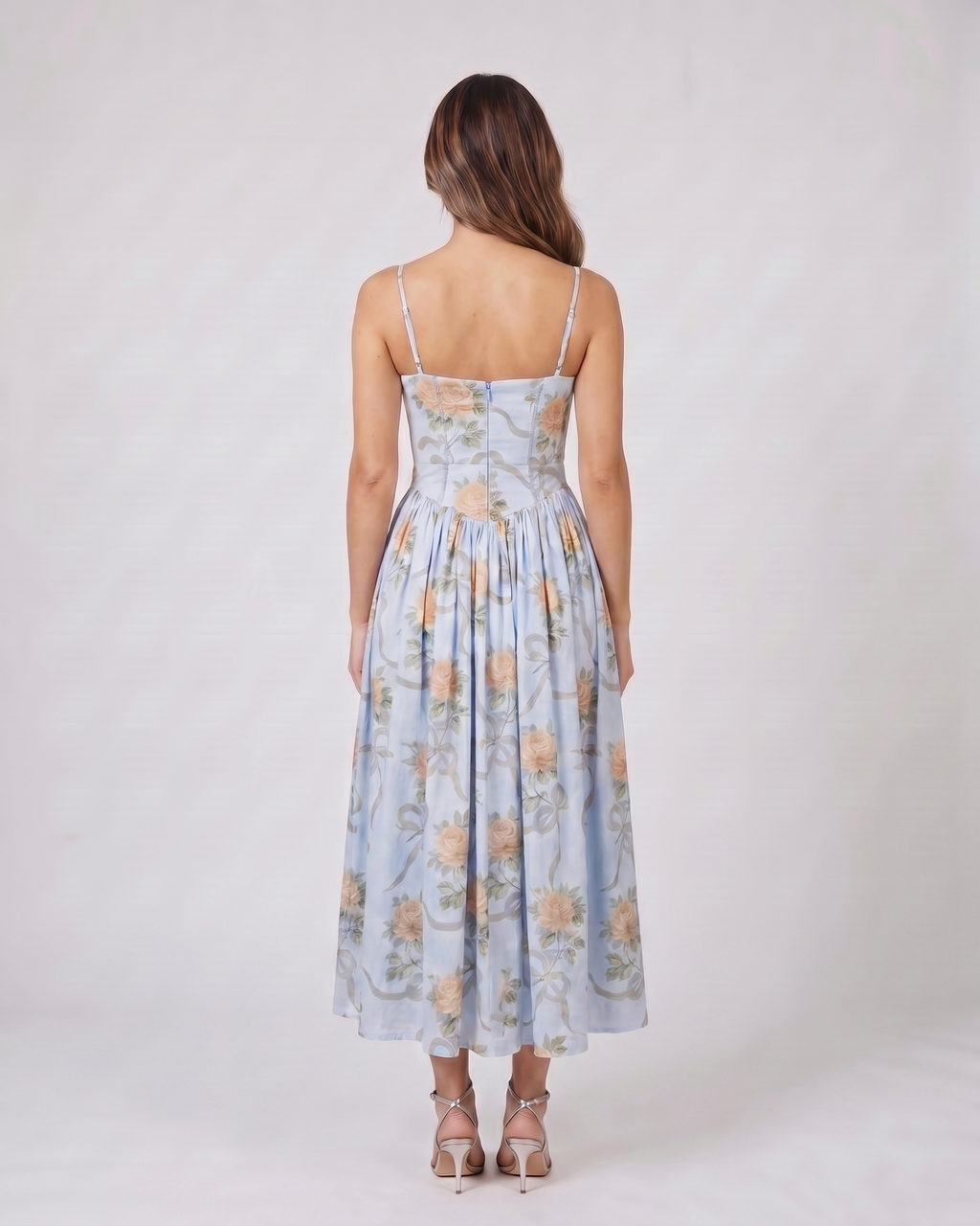 Back view of blue floral strapless corset midi dress showing solid back with center back zipper closure