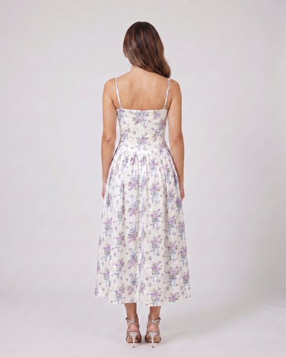 Back view of creamy floral floral strapless corset midi dress showing solid back with center back zipper closure