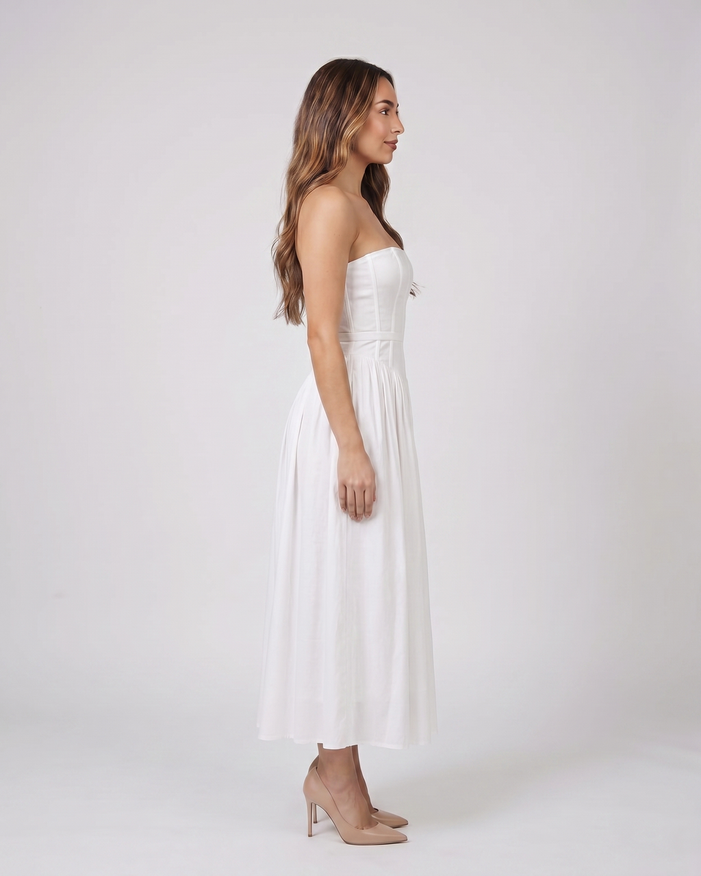 Side view of white floral strapless corset midi dress