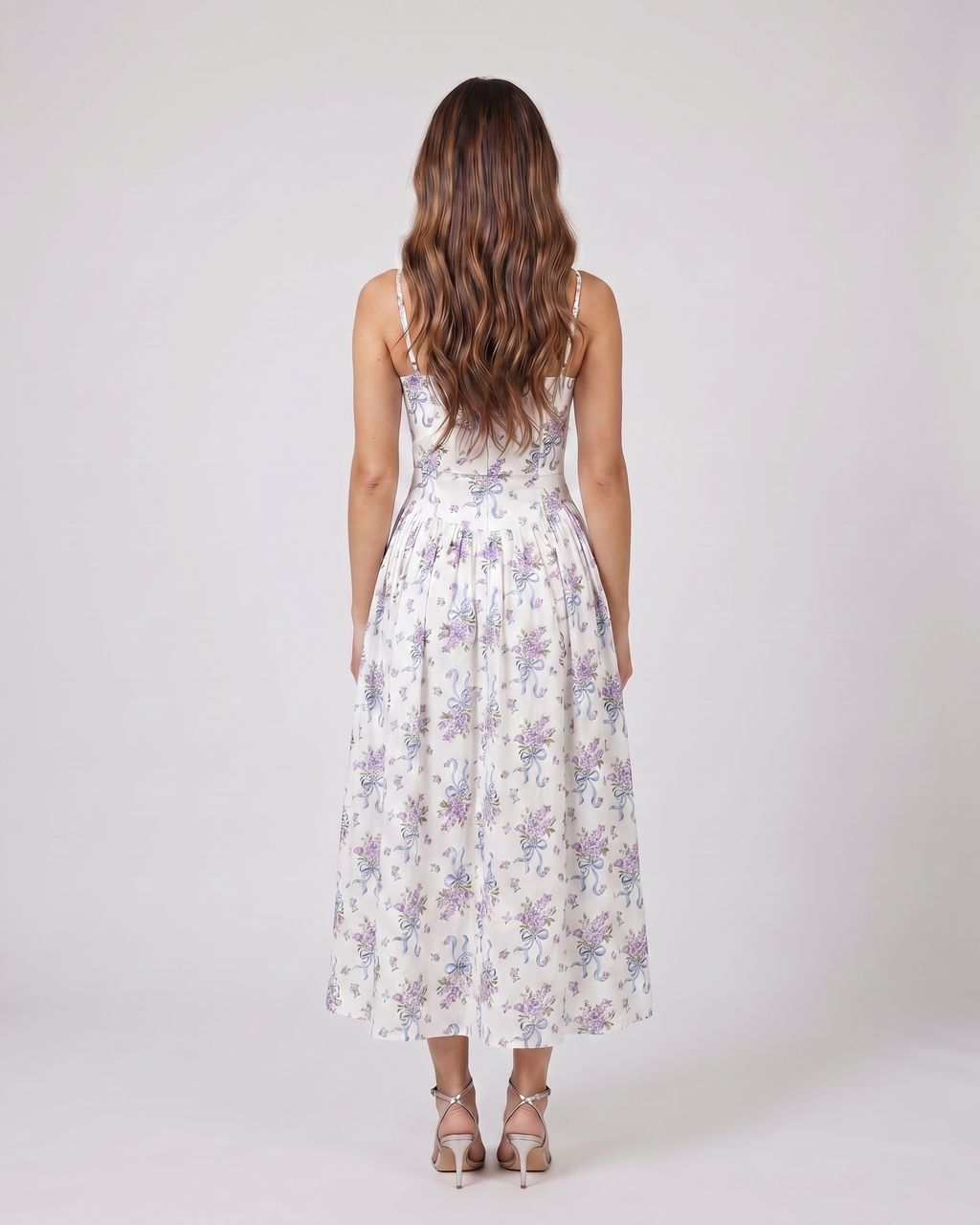 Back view of floral strapless corset midi dress showing solid back with center back zipper closure