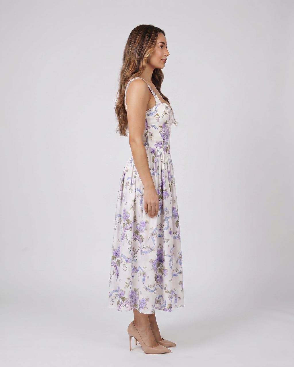 Side view of white posy floral strapless corset midi dress