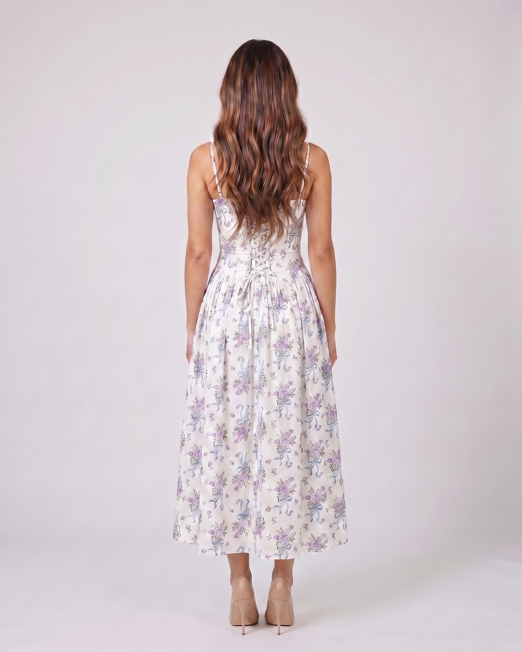 Back view of white posy floral strapless corset midi dress showing solid back with center back zipper closure