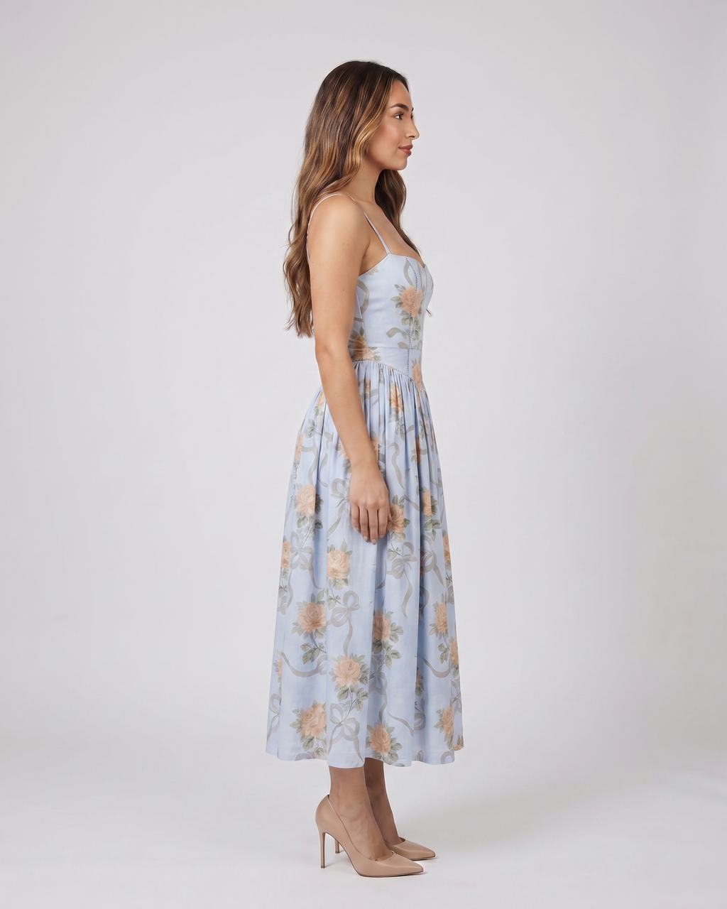 Side view of blue floral strapless corset midi dress