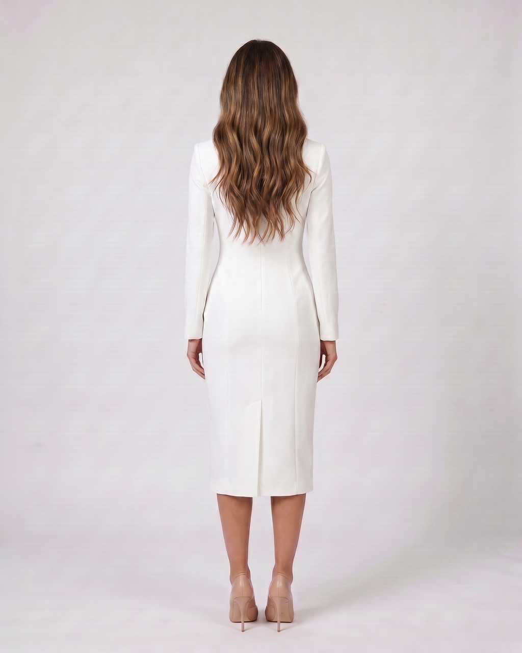 Back view of white formal long sleeve v neck midi dress showing solid back with center back kick vent at hem