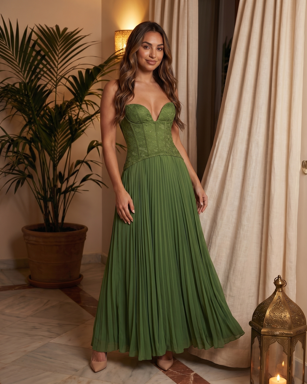 Model in green formal sweetheart sleeveless maxi dress in villa interior setting